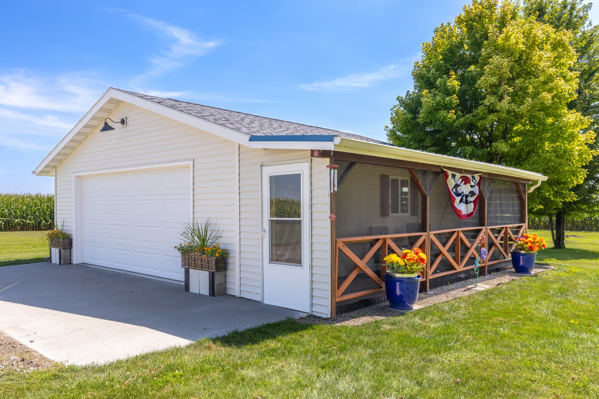 New 22x24 detached garage with attached screened-in porch and country views